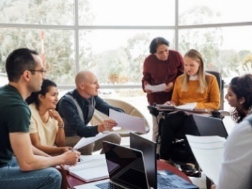 A group of people having a meeting. 