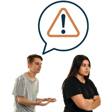 A person with their arms crossed. There is someone behind them, with a speech bubble and a warning symbol inside it. 