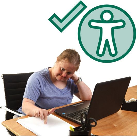 A person with disability reading an accessible document at a desk with a laptop. Above them is a tick and an accessibility icon.