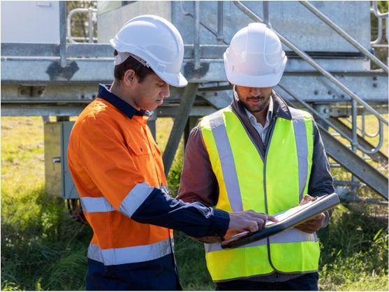 An employer with a worker at a construction site.