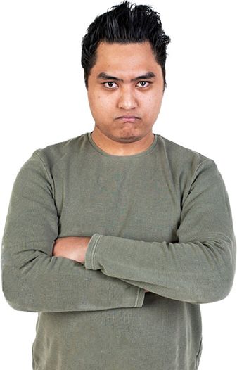 A person with an upset expression and their arms crossed.