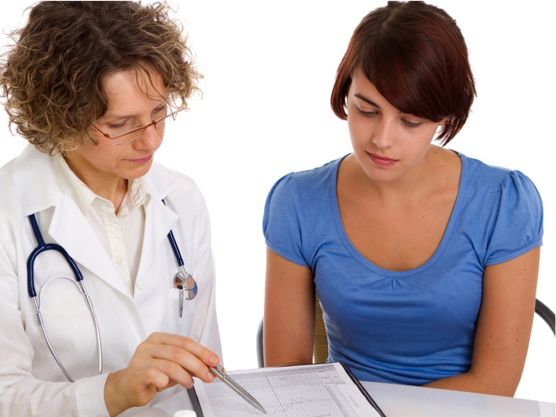 A person with disability having a conversation with a health care worker.