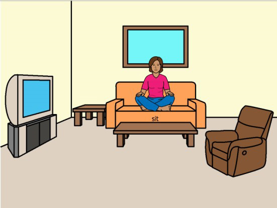 Person sitting in a room with furniture.