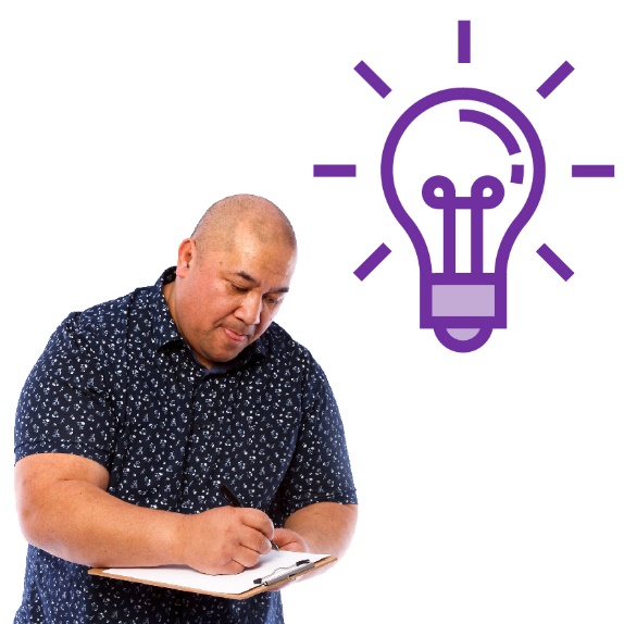 A person writing on a document with a lightbulb above them.