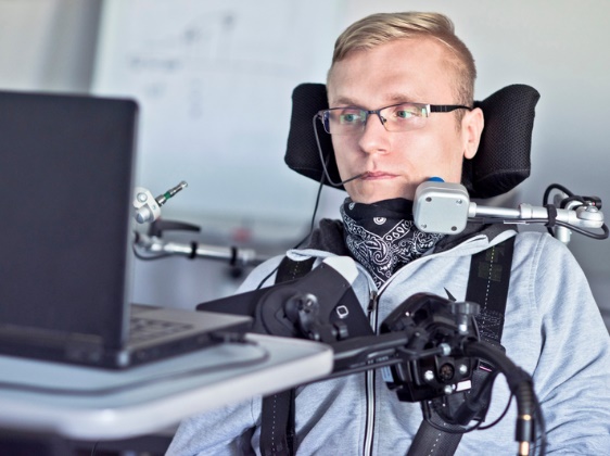 A person with disability using assistive technology. 