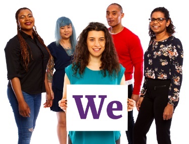 A group of people with a person at the front holding a sign that says 'We'.