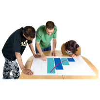 A group of people looking at a graph on a table.