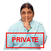 A person with their finger to their mouth signalling for things to be kept private