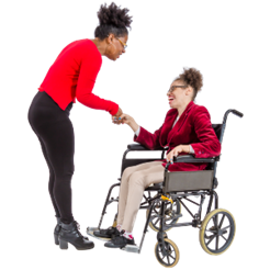 A person shaking hands with a person in a wheelchair.