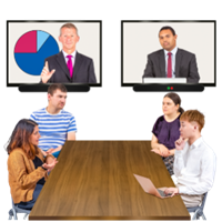 A group of people having a discussion around a table. Two people are on a screen.