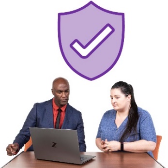 A safety icon and 2 people using a laptop.