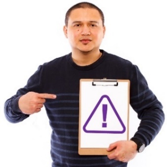 A person pointing at a sign with a problem icon.