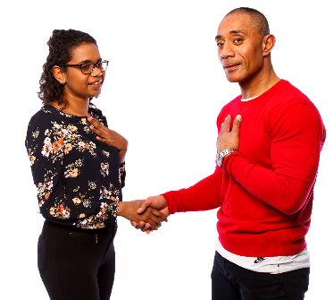 2 providers with their hands on their hearts while they shake hands.