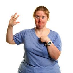 A person with their hand up, pointing at themselves.