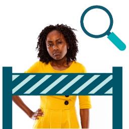 A person standing behind a barrier. Above is a focus symbol.